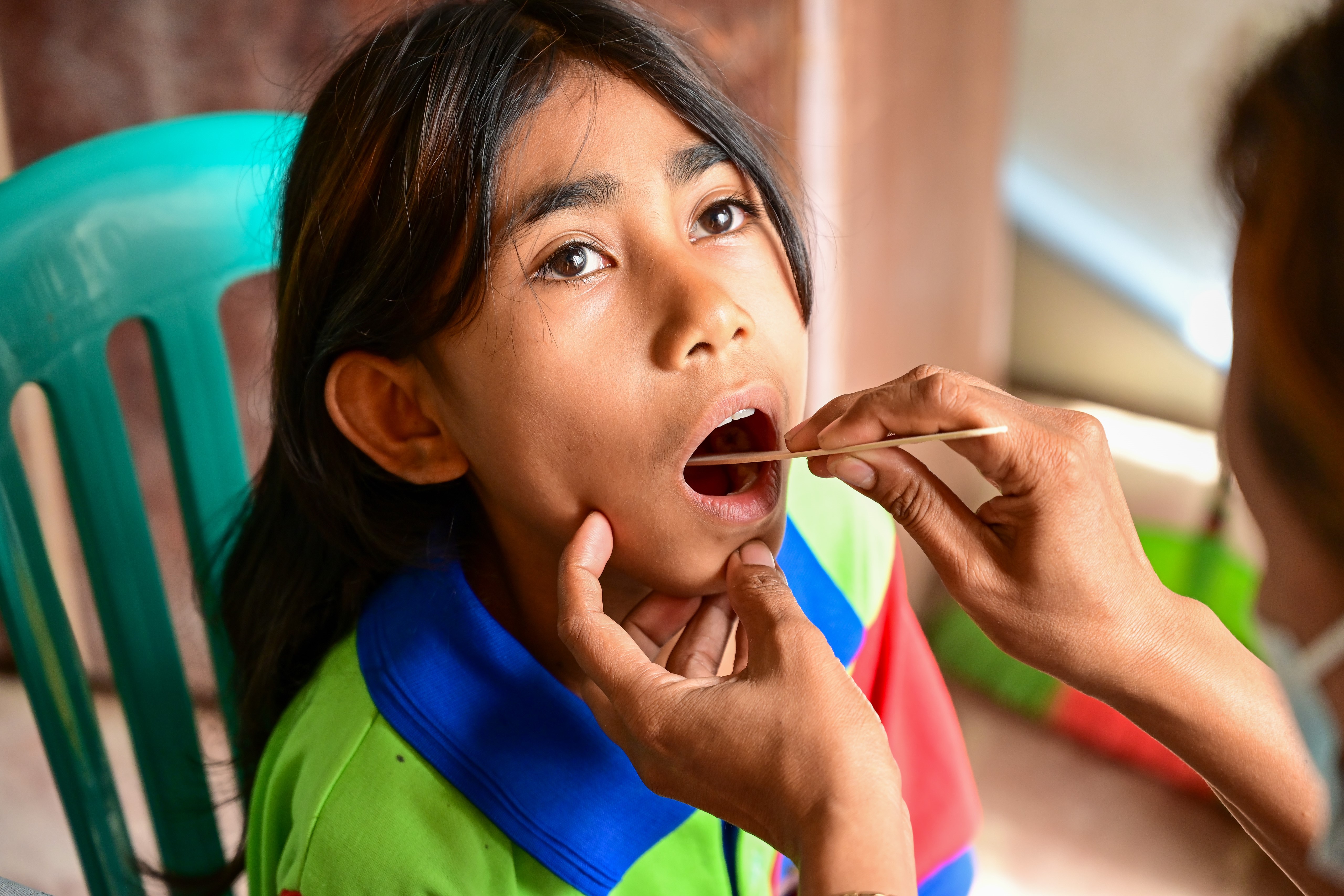 Student receiving oral checkup