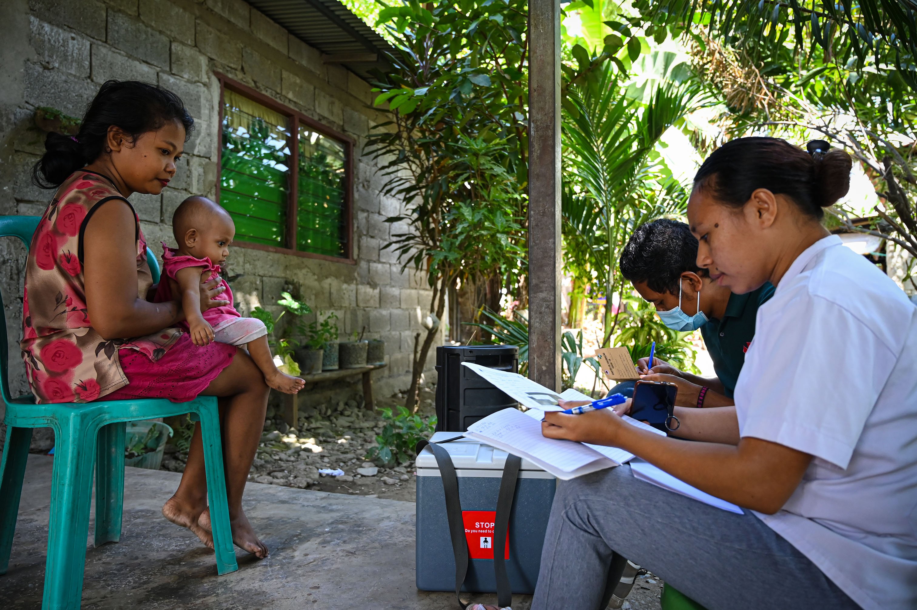 Vaccinators are interviewing patient